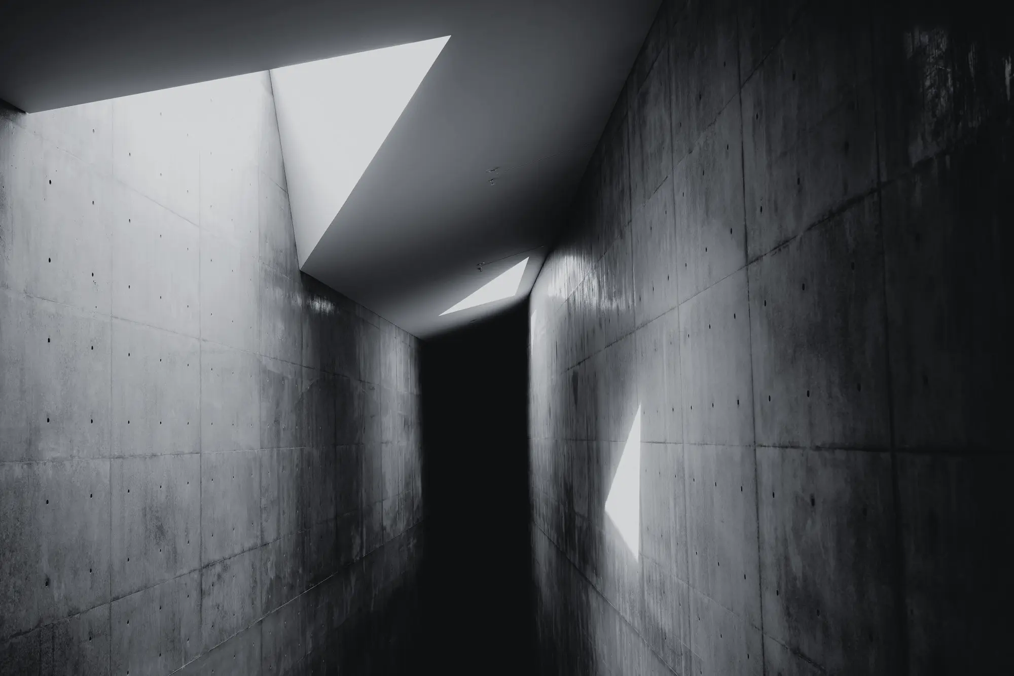 Concrete passage with sharply drawn incoming light